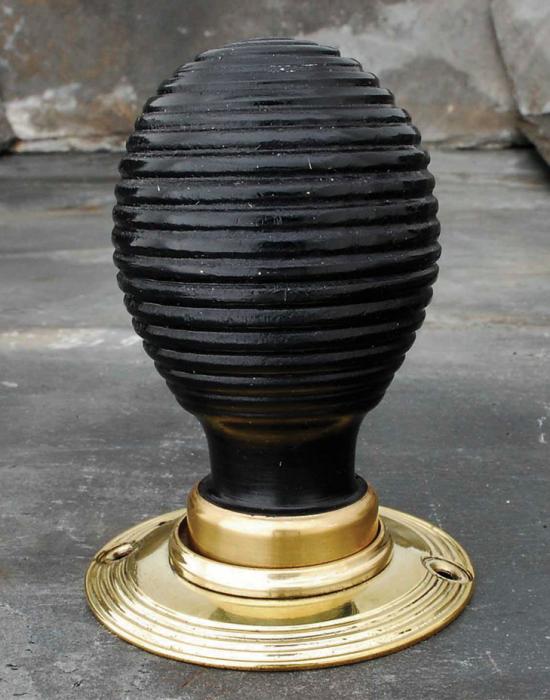 Pair of elongated ebonised wood beehive door knobs