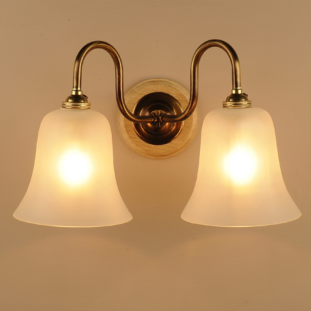 Double Etched Bell Wall Light in Antiqued Brass