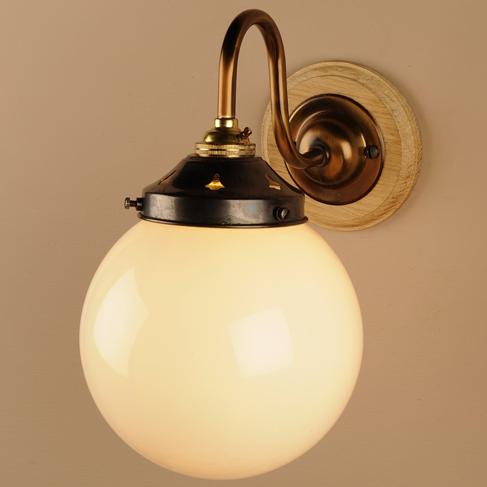 Single Opal Globe Wall Light in Antiqued Brass